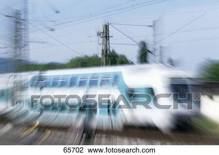 Blurred view of train on track View Large Photo Image Stock Image - Blurred view of train on track . Fotosearch