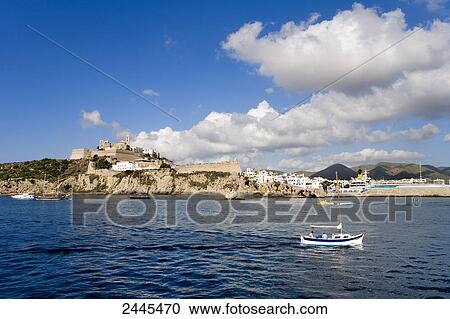 Boat in sea with town in background, Dalt Vila, Ibiza, Balearic Islands, Spain View Large Photo Image Stock Image - Boat in sea with town in background, Dalt Vila, Ibiza, Balearic Islands, Spain . Fotosearch