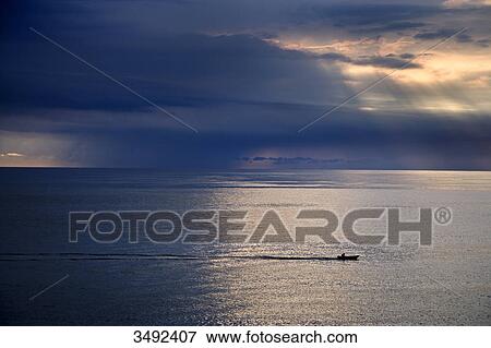 Stock Photo - Boat in the North Sea, Kampen, Sylt, Germany, elevated view . Fotosearch