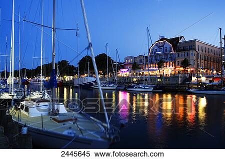Stock Photography - Boats at harbor at night, Warnemunde, Rostock, Mecklenburg-West Pomerania, Germany . Fotosearch