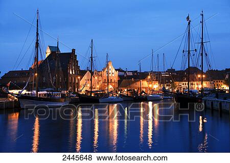 Boats at harbor at night, Wismar, Mecklenburg-West Pomerania, Germany View Large Photo Image Stock Photo - Boats at harbor at night, Wismar, Mecklenburg-West Pomerania, Germany . Fotosearch