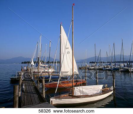 Boats at harbor, Lake Chiemsee, Bavaria, Germany View Large Photo Image Stock Photograph - Boats at harbor, Lake Chiemsee, Bavaria, Germany . Fotosearch