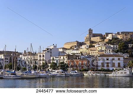 Stock Photo - Boats at marina in town, Dalt Vila, Ibiza, Balearic Islands, Spain . Fotosearch