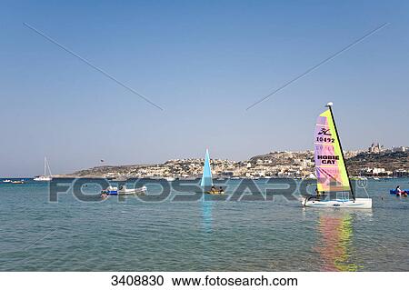 Boats at Mellieha Bay, town in the background, Malta View Large Photo Image Stock Image - Boats at Mellieha Bay, town in the background, Malta . Fotosearch
