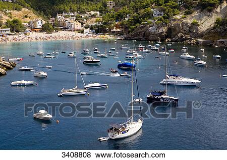 Boats at the bay of Cala Vadella, Ibiza, Spain, elevated view View Large Photo Image Stock Photo - Boats at the bay of Cala Vadella, Ibiza, Spain, elevated view . Fotosearch