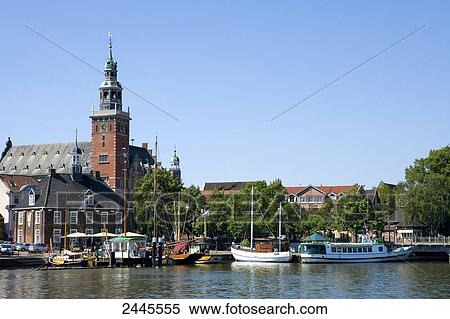 Boats in river near city hall, Leer, Lower Saxony, Germany View Large Photo Image Stock Photography - Boats in river near city hall, Leer, Lower Saxony, Germany . Fotosearch
