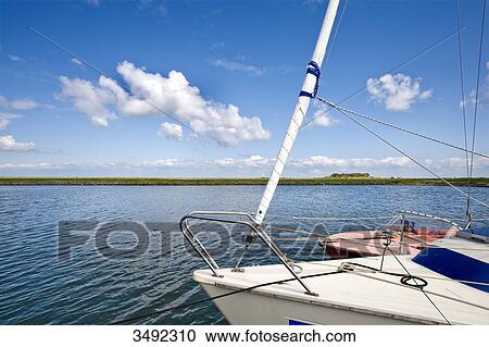 Stock Image - Boats in the harbour of Hallig Hooge, Schleswig-Holstein, Germany, elevated view . Fotosearch