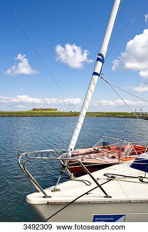 Boats in the harbour of Hallig Hooge, Schleswig-Holstein, Germany, elevated view View Large Photo Image Stock Photo - Boats in the harbour of Hallig Hooge, Schleswig-Holstein, Germany, elevated view . Fotosearch