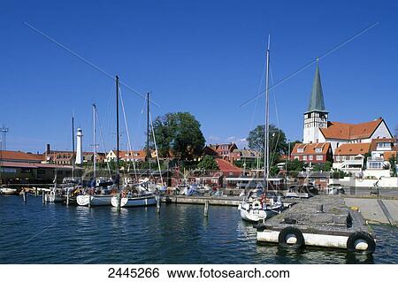 Boats on harbor with church in background, Ronne, Bornholm, Denmark View Large Photo Image Stock Photograph - Boats on harbor with church in background, Ronne, Bornholm, Denmark . Fotosearch