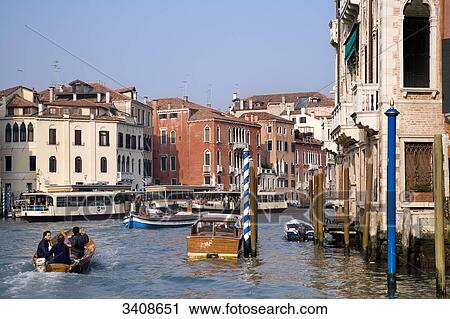 Stock Image - Boats on the Canal Grande, Murano, Italy . Fotosearch