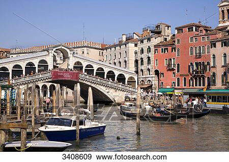 Stock Photo - Boats on the Canale Grande at the Rialto Bridge, Venice, Italy . Fotosearch