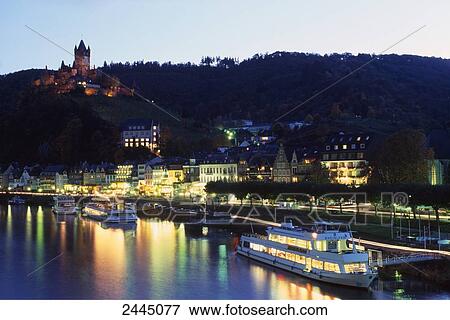 Stock Photo - Buildings lit up at dusk, Moselle River, Beilstein, Cochem-Zell, Rhineland-Palatinate, Germany . Fotosearch