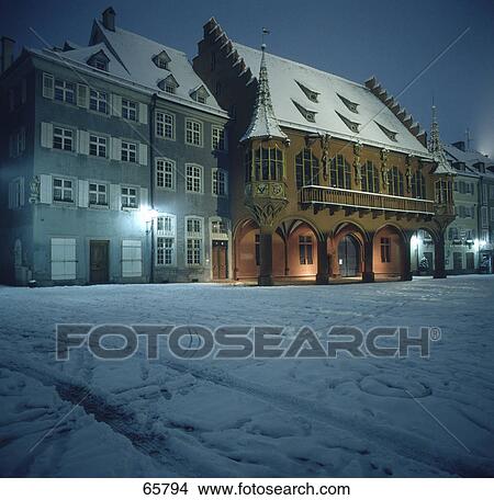 Buildings lit up at night, Muensterplatz, Freiburg, Germany View Large Photo Image Picture - Buildings lit up at night, Muensterplatz, Freiburg, Germany . Fotosearch