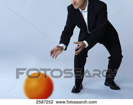 Businessman catching ball View Large Photo Image Stock Image - Businessman catching ball . Fotosearch