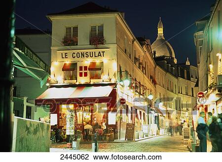 Stock Image - Cafe lit up at night, Paris, France . Fotosearch