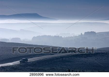 Stock Photograph - Car on country road, Brecon Beacons National Park, Great Britain, Wales, Powys . Fotosearch