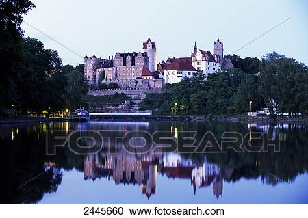 Stock Image - Castle at riverbank, Bernburg Castle, Bernburg, Saale River, Saxony-Anhalt, Germany . Fotosearch