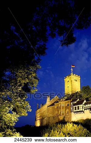 Stock Photo - Castle lit up at dusk, Wartburg Castle, Eisenach, Thuringia, Germany . Fotosearch