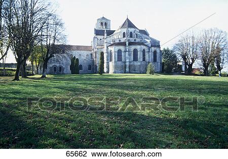 Cathedral on grassy landscape, Vezelay, France View Large Photo Image Stock Image - Cathedral on grassy landscape, Vezelay, France . Fotosearch