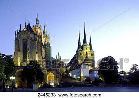 Stock Image - Cathedrals lit up at dusk, Thuringia, Germany . Fotosearch