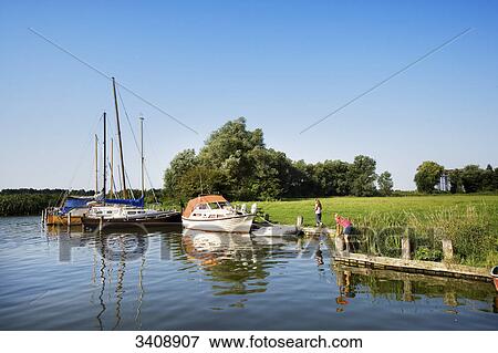 Children at the harbour of Karnin, Mecklenburg-Western Pomerania, Germany View Large Photo Image Stock Photo - Children at the harbour of Karnin, Mecklenburg-Western Pomerania, Germany . Fotosearch