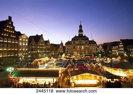 Stock Photo - Christmas Market in town square lit up at dusk Lueneburg Lower Saxony Germany . Fotosearch