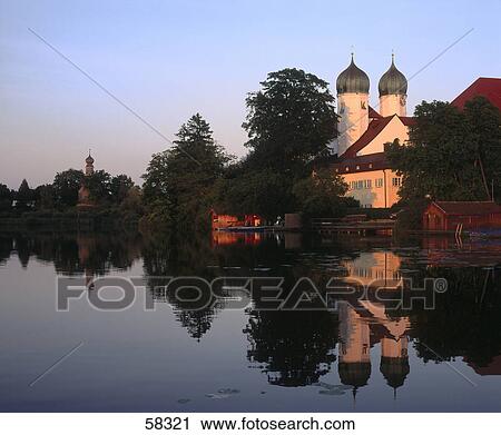 Stock Image - Church at riverside, Seeon Abbey, Bavaria, Germany . Fotosearch