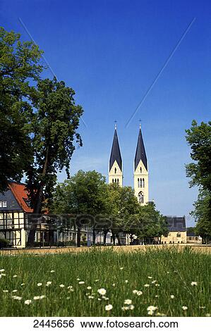 Stock Photograph - Church in meadow, Halberstadt, Saxony-Anhalt, Germany . Fotosearch