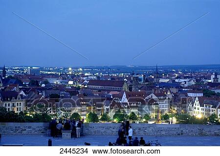 Picture - Cityscape lit up at dusk, Zitadelle Petersberg, Erfurt, Thuringia, Germany . Fotosearch