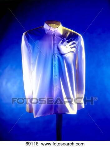 Close-up of blue shirt displayed on stand View Large Photo Image Stock Photo - Close-up of blue shirt displayed on stand . Fotosearch