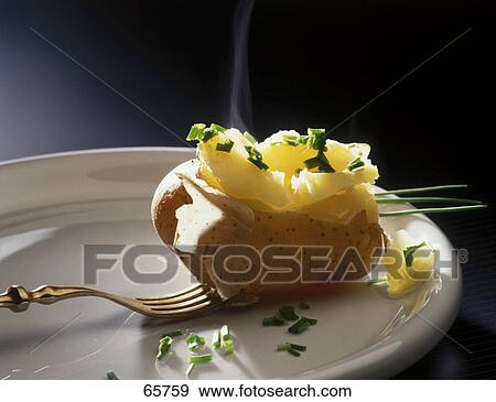 Stock Photo - Close-up of boiled potato on fork . Fotosearch