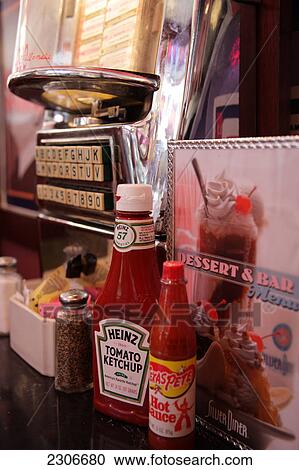 Close-up of bottles of tomato ketchup  View Large Photo Image Stock Image - Close-up of bottles of tomato ketchup . Fotosearch