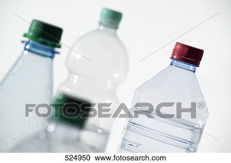 Stock Image - Close-up of bottles of water . Fotosearch