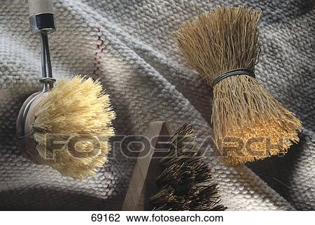 Stock Image - Close-up of brushes on mop . Fotosearch