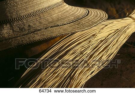 Picture - Close-up of bundle of wheat and hat, San Blas Islands, Panama . Fotosearch