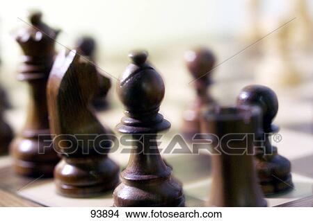 Close-up of chess pieces on chessboard View Large Photo Image Picture - Close-up of chess pieces on chessboard . Fotosearch