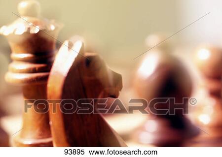 Stock Photography - Close-up of chess pieces on chessboard . Fotosearch