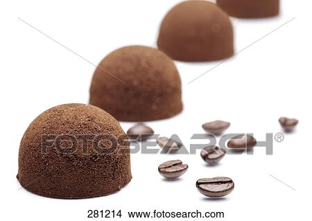 Picture - Close-up of chocolate truffles and coffee beans . Fotosearch