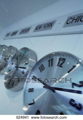 Stock Image - Close-up of clocks in row . Fotosearch