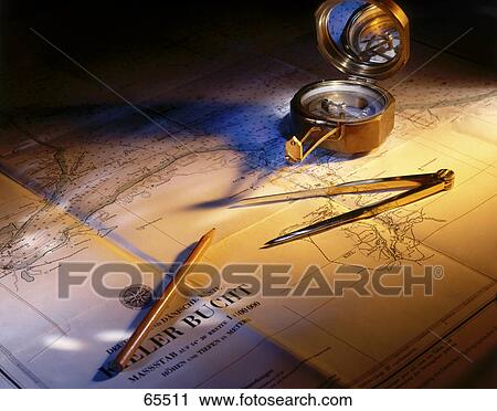 Close-up of compass on nautical chart View Large Photo Image Stock Image - Close-up of compass on nautical chart . Fotosearch