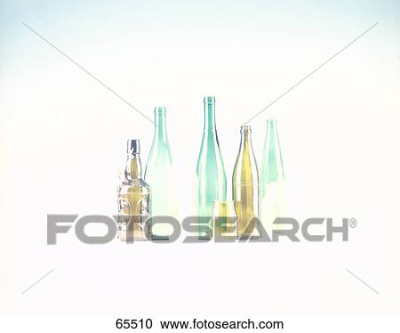 Stock Image - Close-up of empty bottles in row . Fotosearch