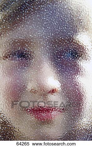 Close-up of girl behind window glass View Large Photo Image Stock Photography - Close-up of girl behind window glass . Fotosearch