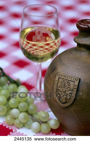 Close-up of glass and bottle of white wine with grapes View Large Photo Image Stock Photography - Close-up of glass and bottle of white wine with grapes . Fotosearch