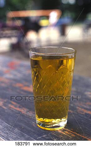 Close-up of glass of apple juice View Large Photo Image Stock Image - Close-up of glass of apple juice . Fotosearch