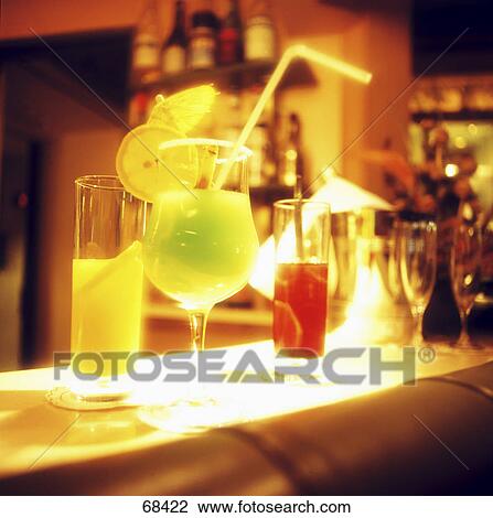 Stock Image - Close-up of glasses of cocktails . Fotosearch
