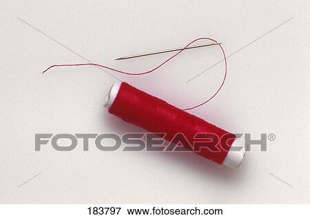 Close-up of needle and spool of thread View Large Photo Image Stock Photo - Close-up of needle and spool of thread . Fotosearch