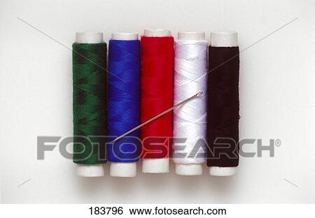 Close-up of needle and spools of thread View Large Photo Image Stock Photograph - Close-up of needle and spools of thread . Fotosearch