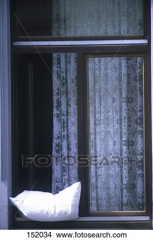 Close-up of pillow on window pane View Large Photo Image Picture - Close-up of pillow on window pane . Fotosearch