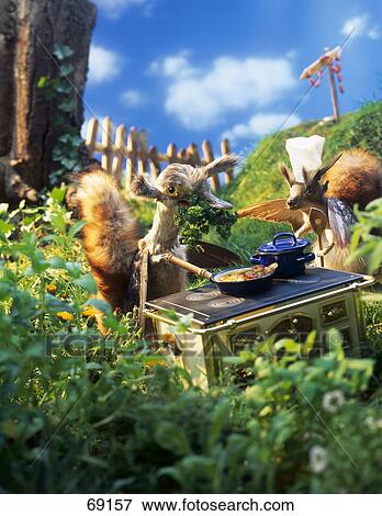 Close-up of puppets cooking food View Large Photo Image Stock Photo - Close-up of puppets cooking food . Fotosearch