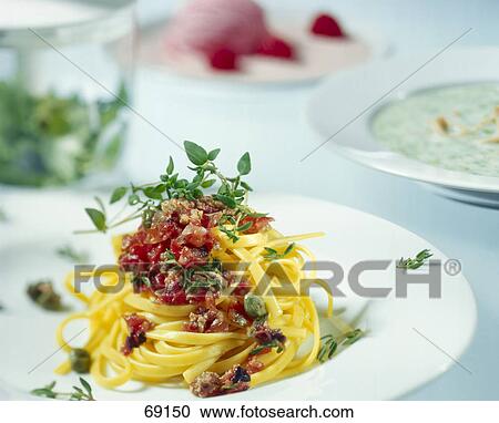 Close-up of spaghetti and tomato sauce on plate View Large Photo Image Stock Image - Close-up of spaghetti and tomato sauce on plate . Fotosearch